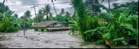 água de enchente cobre casa no município de baco, nas filipinas